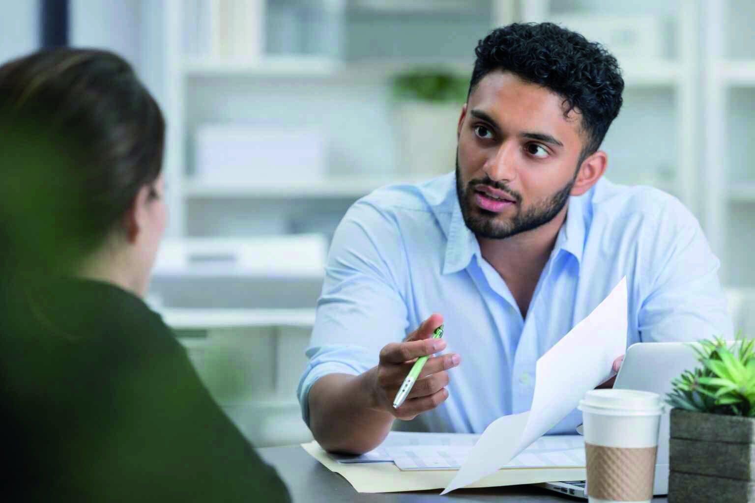 Counselor discussing subject interests and career goals with a student